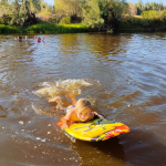 Boy swimming in river